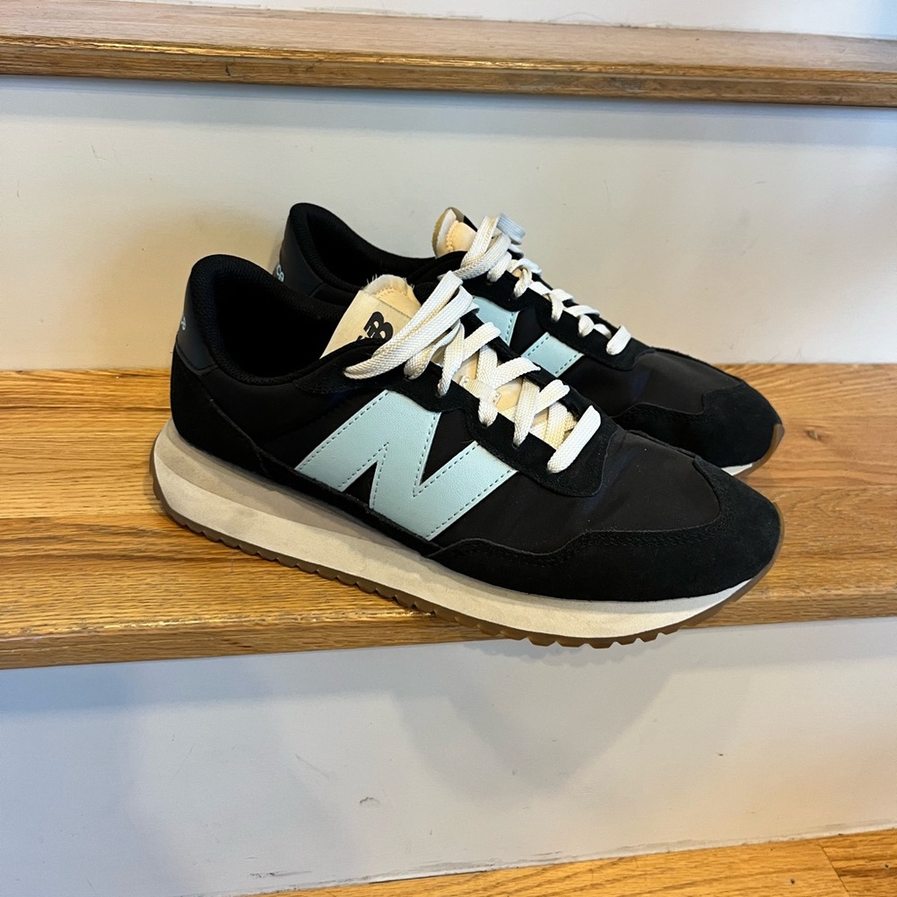 New Balance Women’s Black and Light Blue Sneakers